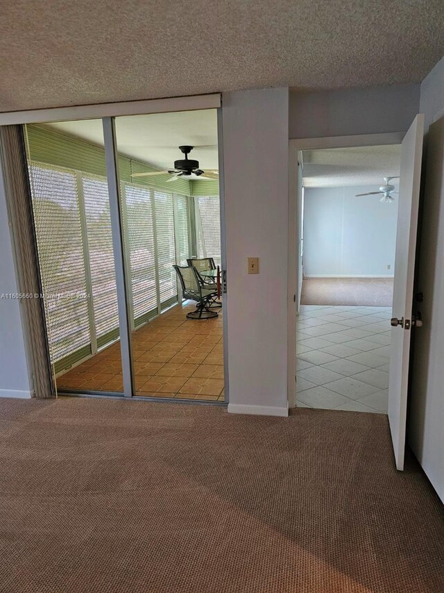 interior space with tile floors and a textured ceiling