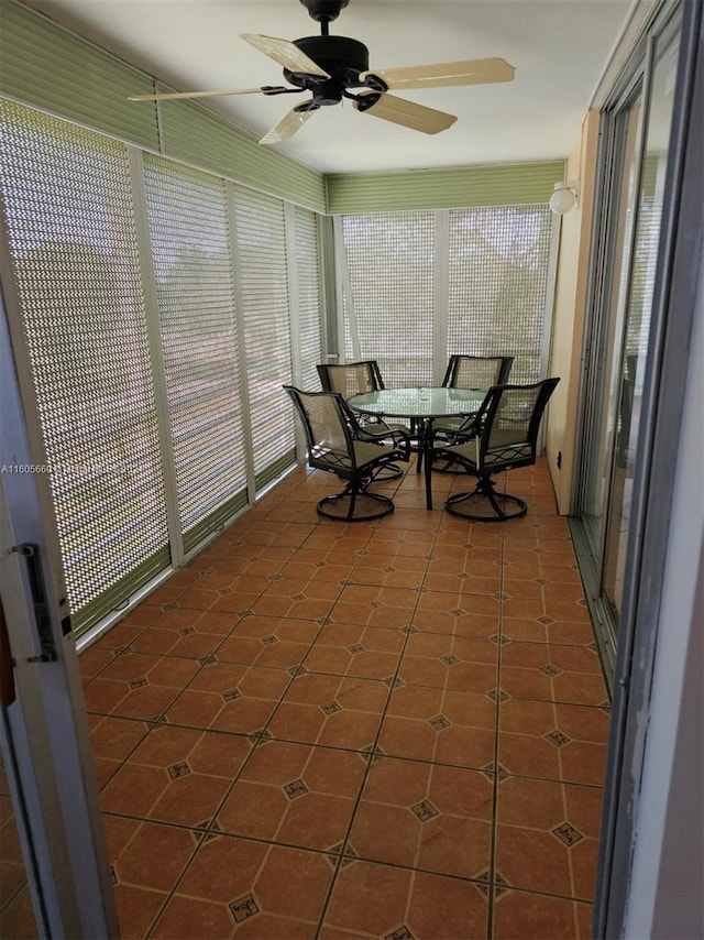 sunroom / solarium with ceiling fan and a wealth of natural light