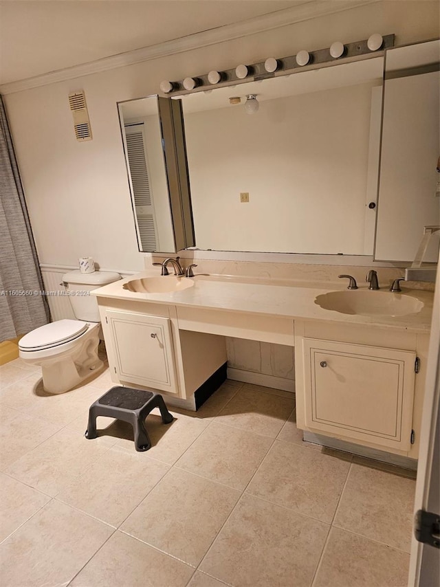 full bath with tile patterned flooring, crown molding, visible vents, and a sink