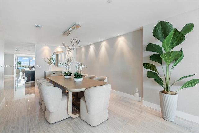 dining room featuring light tile patterned floors