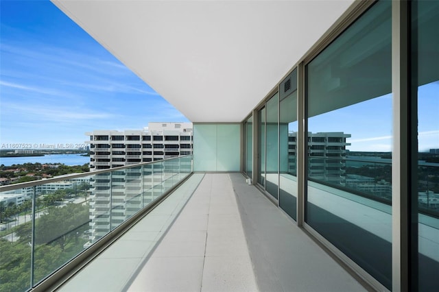 balcony featuring a water view