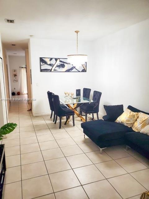 living room featuring light tile patterned floors