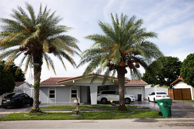 mediterranean / spanish home featuring a garage