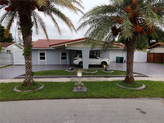 view of front of property with a garage and a carport