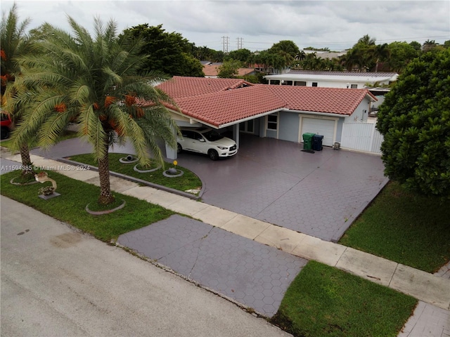 mediterranean / spanish home featuring a garage