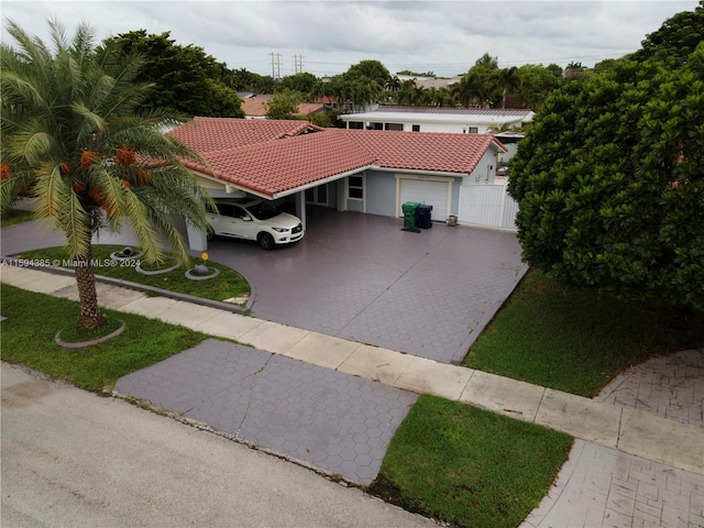 mediterranean / spanish home with a garage