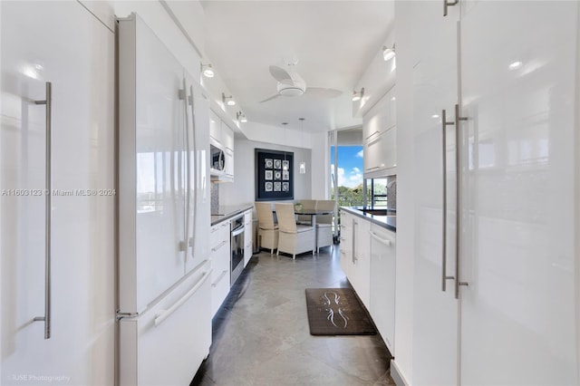 kitchen featuring white cabinetry, stainless steel appliances, and ceiling fan