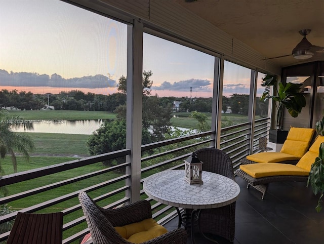 sunroom with a healthy amount of sunlight and a water view