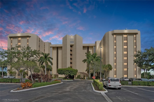 view of outdoor building at dusk