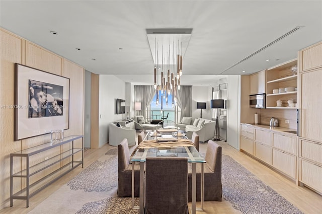 dining area featuring light wood-type flooring