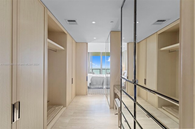 9703 Collins Ave Unit 1205, Bal Harbour, FL 33154 - hall with a wall of windows