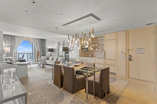 9703 Collins Ave Unit 1205, Bal Harbour, FL 33154 - dining space featuring light wood-style floors
