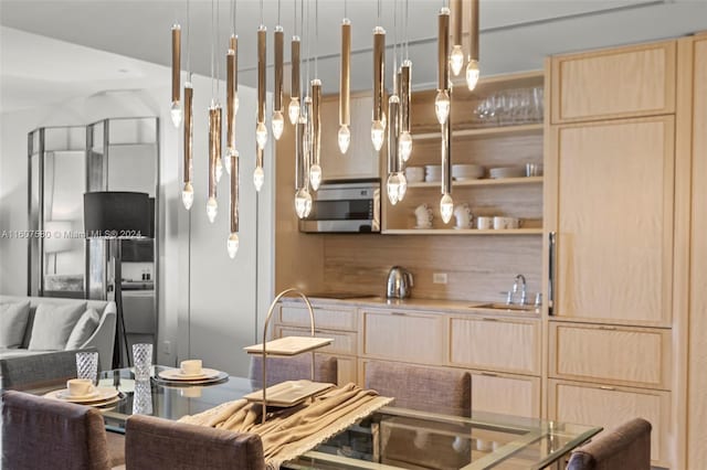 kitchen with sink and light brown cabinets