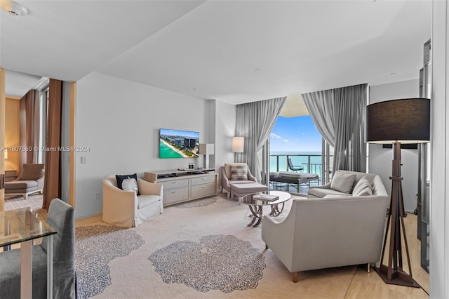 9703 Collins Ave Unit 1205, Bal Harbour, FL 33154 - living room with floor to ceiling windows and light colored carpet