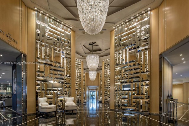 9703 Collins Ave Unit 1205, Bal Harbour, FL 33154 - wine room featuring a chandelier and granite tiled floors