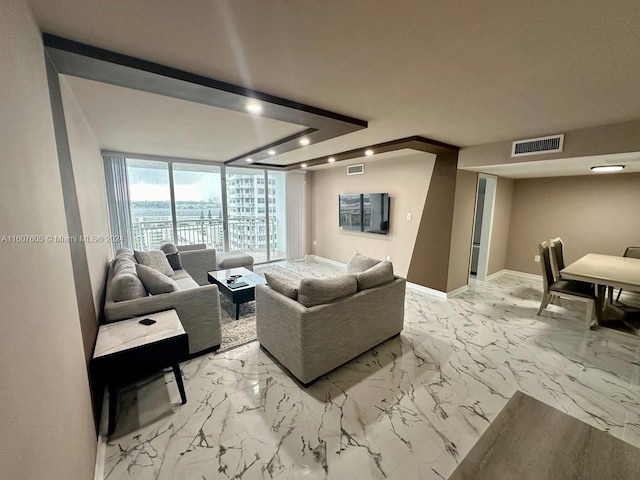 living room with floor to ceiling windows