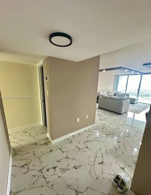 hall featuring a textured ceiling