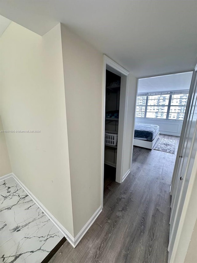 hall with dark hardwood / wood-style flooring