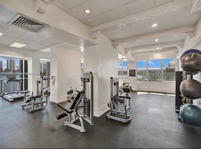 workout area with a paneled ceiling