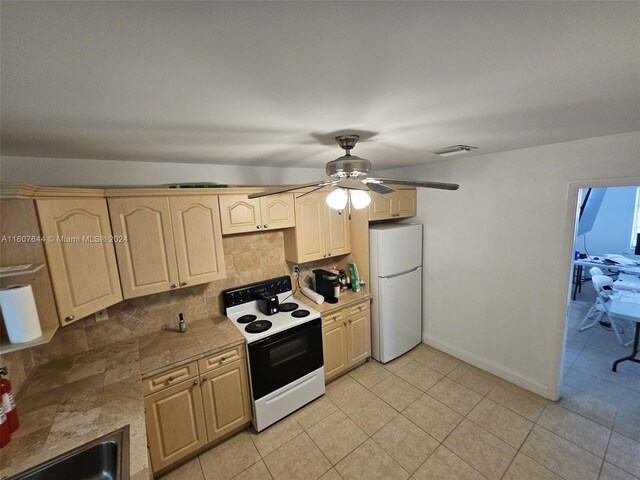 kitchen with light tile patterned flooring, light brown cabinets, white appliances, backsplash, and ceiling fan