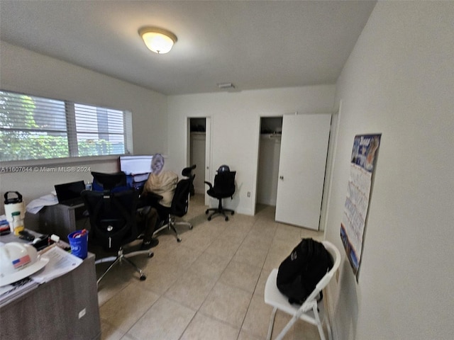 home office with light tile patterned flooring