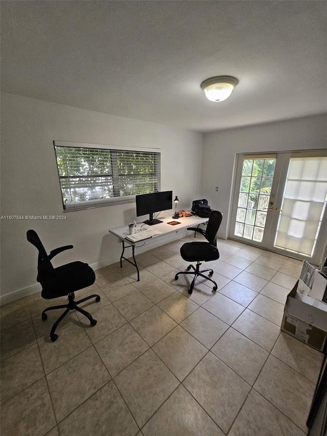 home office featuring tile patterned floors and french doors