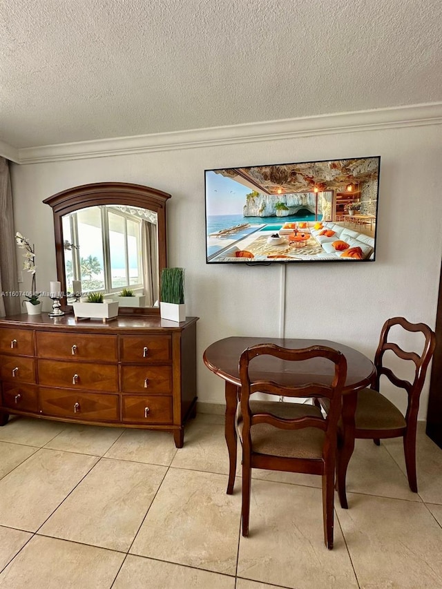 sitting room featuring crown molding, a textured ceiling, and light tile patterned flooring