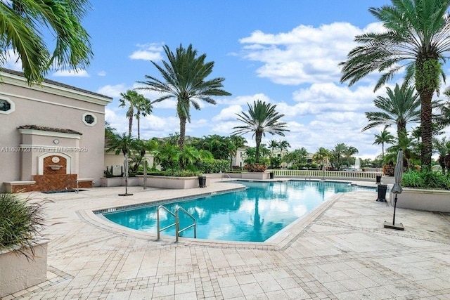 view of swimming pool featuring a patio area