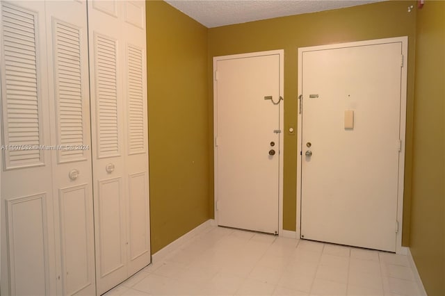 entryway featuring light tile floors