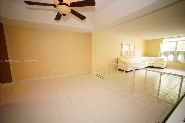 interior space with tile flooring and ceiling fan