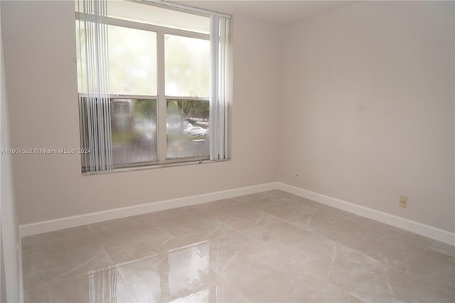 empty room featuring tile floors