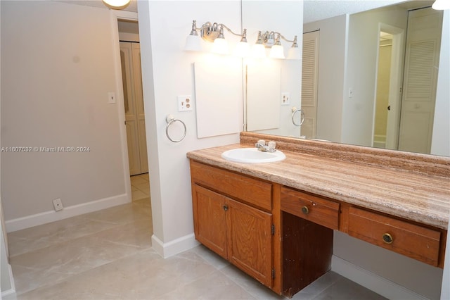 bathroom with vanity and tile floors