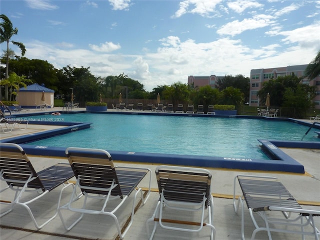 view of swimming pool with a patio area