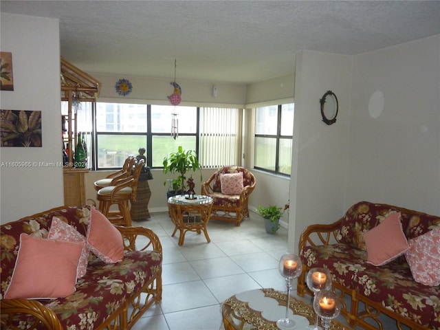 tiled living room with a textured ceiling