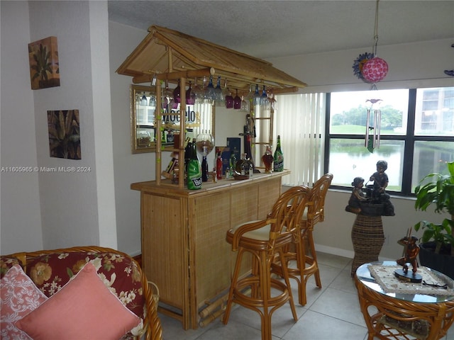 bar with light tile patterned floors