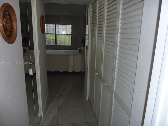 hallway featuring tile patterned floors