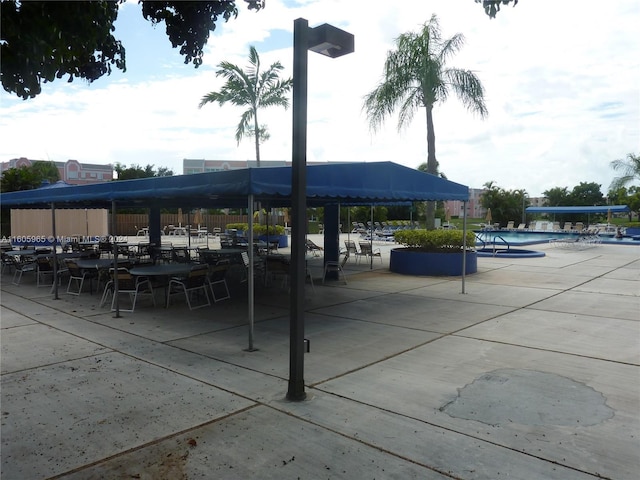 view of patio with a community pool