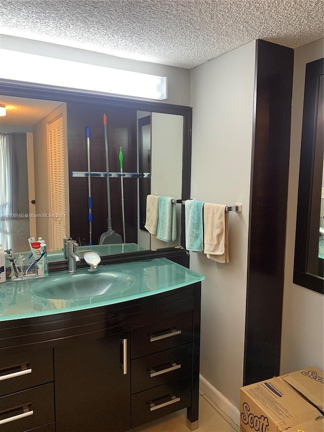 bathroom featuring vanity and a textured ceiling