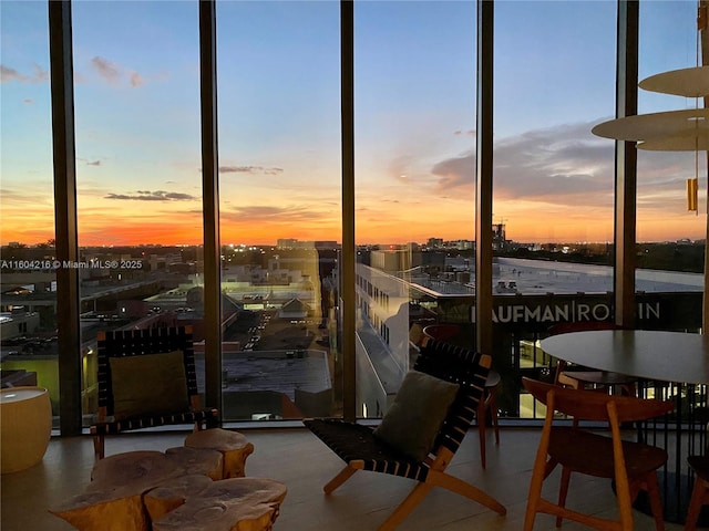 sunroom / solarium featuring a city view