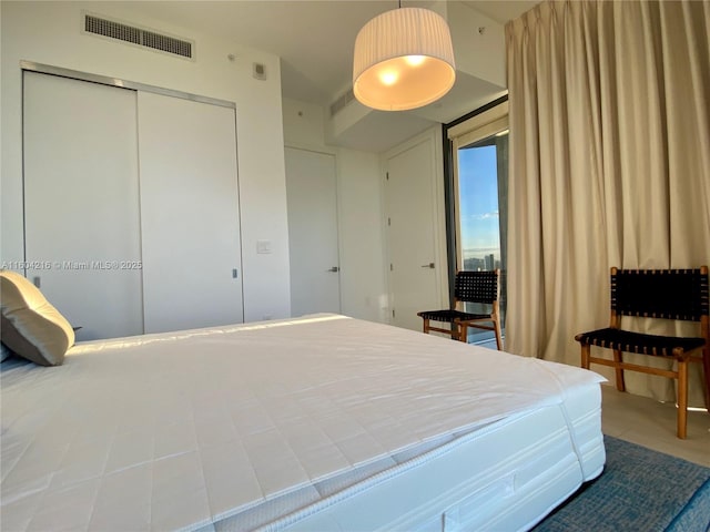 bedroom featuring a closet and visible vents