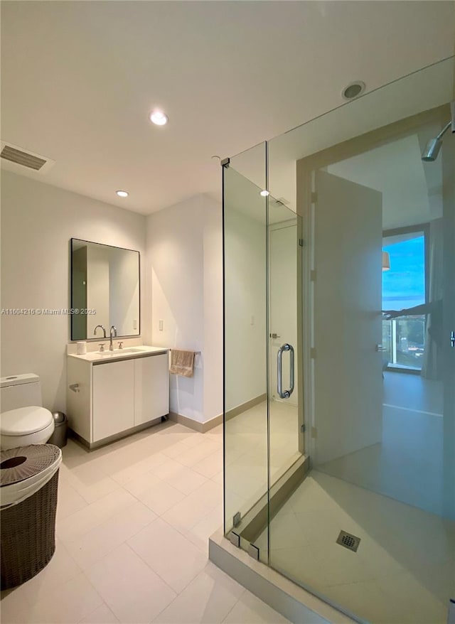 bathroom featuring recessed lighting, visible vents, a stall shower, vanity, and baseboards