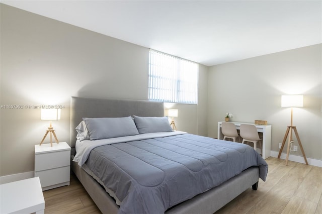 bedroom with light hardwood / wood-style flooring