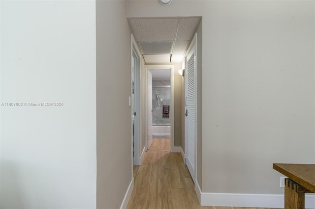 corridor featuring light hardwood / wood-style floors