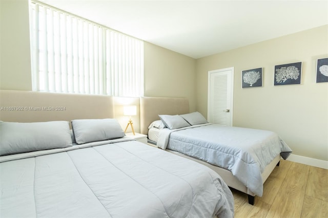 bedroom with light wood-type flooring