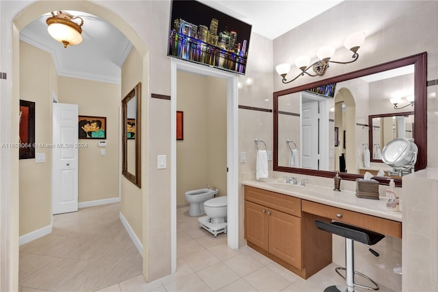 bathroom featuring tile patterned flooring, toilet, vanity, a bidet, and crown molding