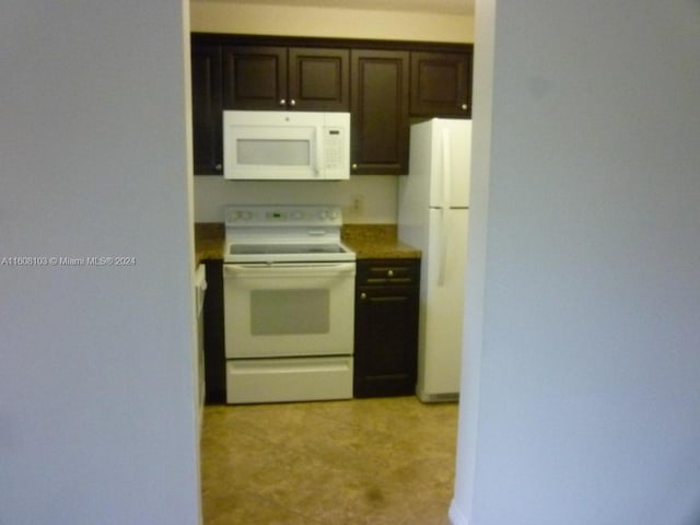 kitchen with dark brown cabinetry and white appliances