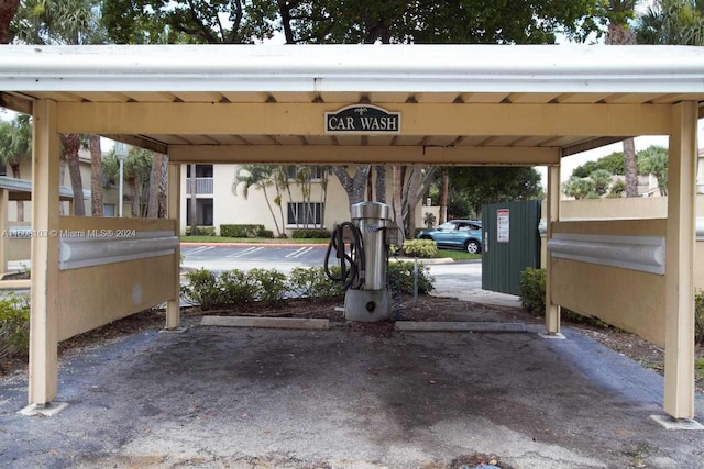 view of parking / parking lot with a carport