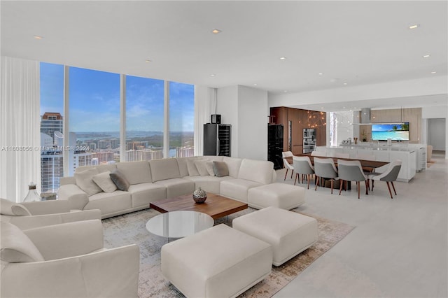 living room featuring a wall of windows