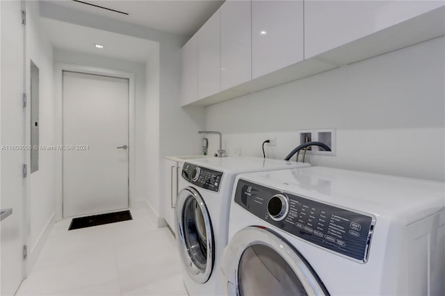 laundry area with cabinets, separate washer and dryer, washer hookup, tile floors, and sink