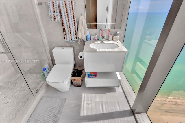 bathroom featuring large vanity and toilet